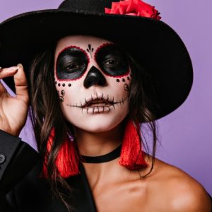 interested-woman-with-scary-face-painting-halloween-portrait-brunette-latin-girl-big-black-hat_copy_800x533